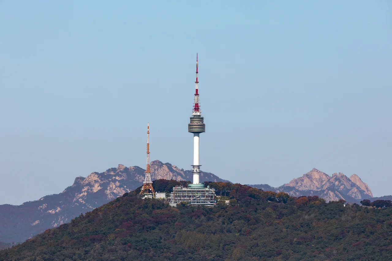Namsan Dulle-gil Walk to N Seoul Tower — Namsan, with Bukhansan in the distance. Source: Seoul Tourism Organization
